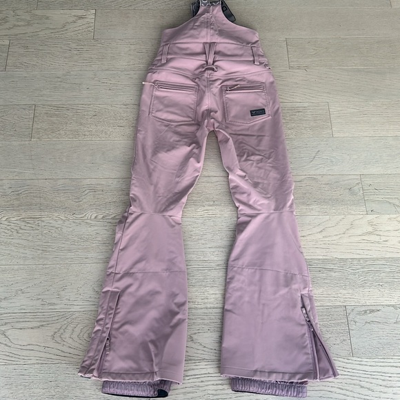 Roxy Women's Summit Bib Pants in pink. - Picture 5 of 9